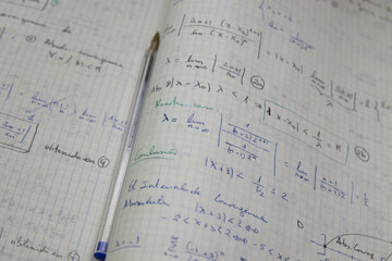 Naklejka premium Close-up of a notebook with mathematical limits exercises