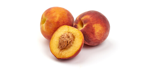 Naklejka na ściany i meble Fresh ripe peaches and and juicy slice with bone, isolated on white background.