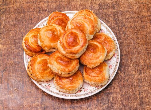 Bakery Chicken Patties in a plate on dark wooden background top view