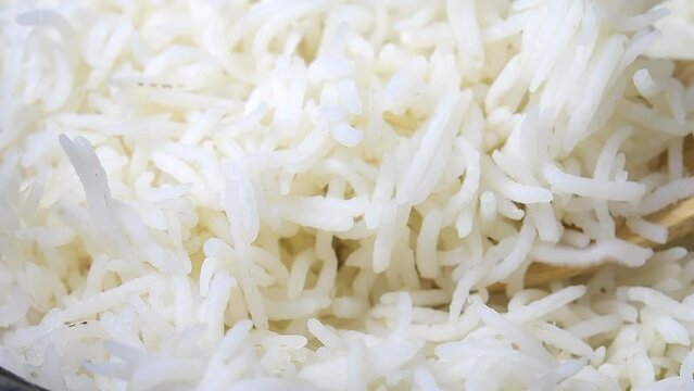 Slow motion of cooked white rice