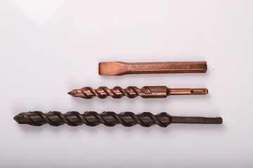 Repair tools made of chocolate standing on a white background. drill bit made of chocolate