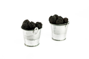 Fototapeta na wymiar blackberry in Metal bucket on white background.
