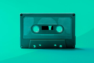 Old Vintage Audio Cassette, Compact Cassette, or Musicassette on a Seamless Trending Colorful Background. Conceptual Photo about eighties music