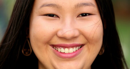 Happy Asian large young woman smiling at camera close-up portrait face