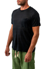 a tanned man in a black T-shirt and green beach shorts on a white background