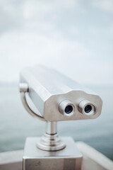 Binocular tube for viewing the panorama of the city - an observation deck for tourists