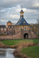 View of water tower and historical city gate known locally as Dalempoort in dutch city of Gorinchem
