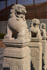 Fototapeta na wymiar stone lion statue in chinese temple