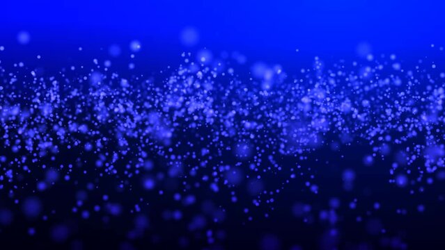 Bright dark blue background with flying transparent particles. A festive Christmas backdrop with simulated snowflakes and free space at the top for your business.