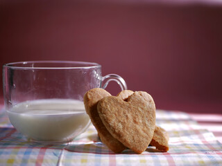 Glass of fresh milk and baked cookies medium shot