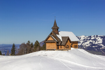 Fototapeta na wymiar The chapel Maria Hilf on the popular ski sport resort Stoos in Canton Schwyz, Swiss Alps