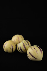cucumber on black background. tropical fruit 