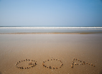 Goa written in shells by the sea in Betalbatim beach