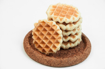 Belgian waffles on a table. holiday cookies on a white background. fresh baking concept. sweet desserts on a light texture