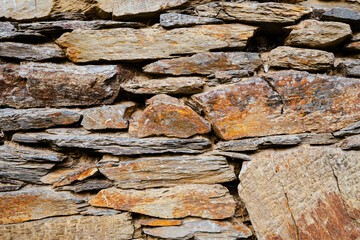 Stone and clay wall texture. Natural stone background.
