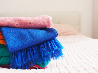 scarf and knitted materials on the bed