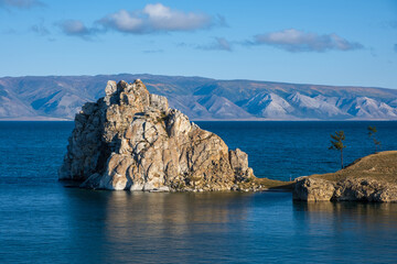 Naklejka premium Shamanka Rock on lake Baikal near Khuzhir village at Olkhon island in September, Siberia, Russia. Lake Baikal is the deepest freshwater lake in the world.