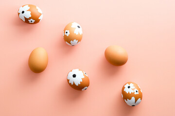 Creative layout with Easter eggs on pastel pink background. Happy Easter card.