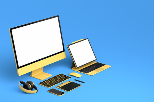 Desktop computer with keyboard, mouse, laptop and headphones on blue background.