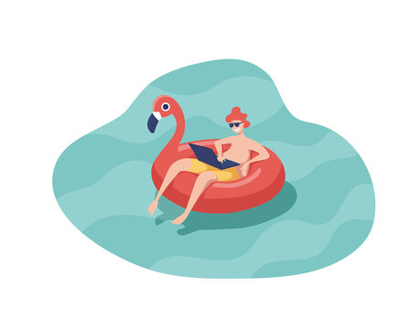 Man With Laptop Swiming On Inflatable Ring In The Shape Of A Pink Flamingo Floating In The Pool.