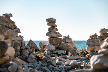 Hand made rock formation on the gravel shore at the town of Rovinj, Croatia