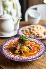 Central Asian Noodle Soup or Stew Lagman with Lamb Meat and Vegetables Garnished with Fresh Parsley