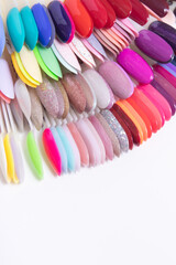 Color palette with nail gel polishes for manicure on a white background.. Vertical format