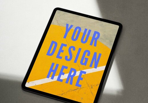 Tablet Mockup on a Concrete Background with Sun Light and Shadows