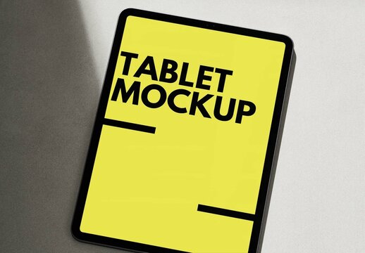 Tablet Mockup on a Grey Background with Sun Light and Shadows