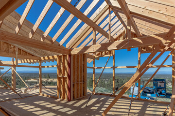 Interior view of a newly home being built with expansive views. Frame is made of lumbar in Oregon