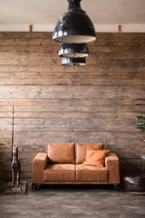 living room interior with leather sofa brown wood plank wall old lamps
