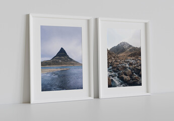 Two White Frames Leaning on Blank Wall Mockup