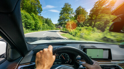 hands of car driver on steering wheel, road trip, driving on highway road - 486149520