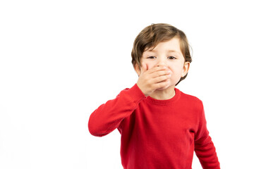 Beautiful kid boy wearing elegant red sweater standing over isolated white background.