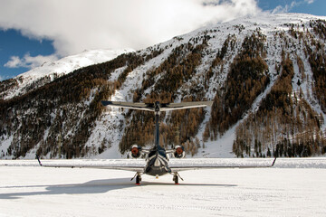 Private jets and aircrafts in the airport of Engadine St Moritz in winter time