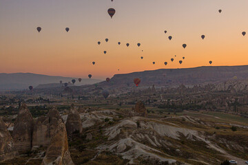 Hot air balloons above Cappadocia landscape, Turkey