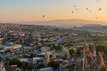 Hot air balloons above Goreme village in Cappadocia, Turkey