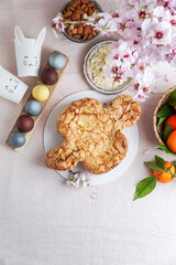 Colomba - traditional italian easter dove cake with glaze, macaranage, almonds