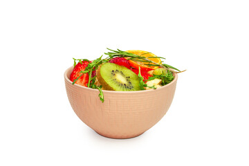 A bowl of fruit salad isolated on a white background. Healthy eating.