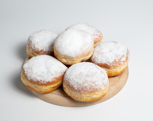 Austrian and german donuts or krapfen.  Faschingskrapfen. Berliner with cream. On wooden background. Selective focus.