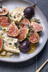 Figs with feta, honey, and microgreens