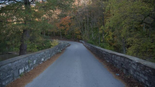 one lane stone bridge in the fall in Kentucky