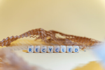 RECYCLED - words from wooden blocks with letters, from information term, packaging material background