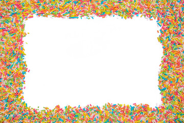 Assortment of multicolored candies on a frame shape with copy space