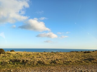 panorama sea view with people relaxing in the background while taking a walk as lifestyle in the sun