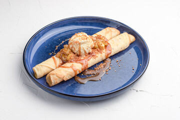 Pancakes with ice cream, sweet pancakes on a white background, Russian cuisine