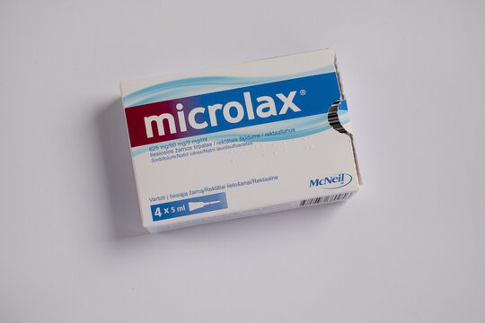 Tallinn, Estonia - 02.08.2022: Microlax enema tube by Delpharm Orl&eacute;ans rectal solution. Medical treatment and pharmacy concept.