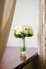 Nice wedding bouquet of roses in a vase
