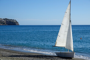 Little sailboat on the beach