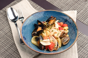 Pasta with seafood, pasta with shrimp mussels squid. pasta with sea delicacies